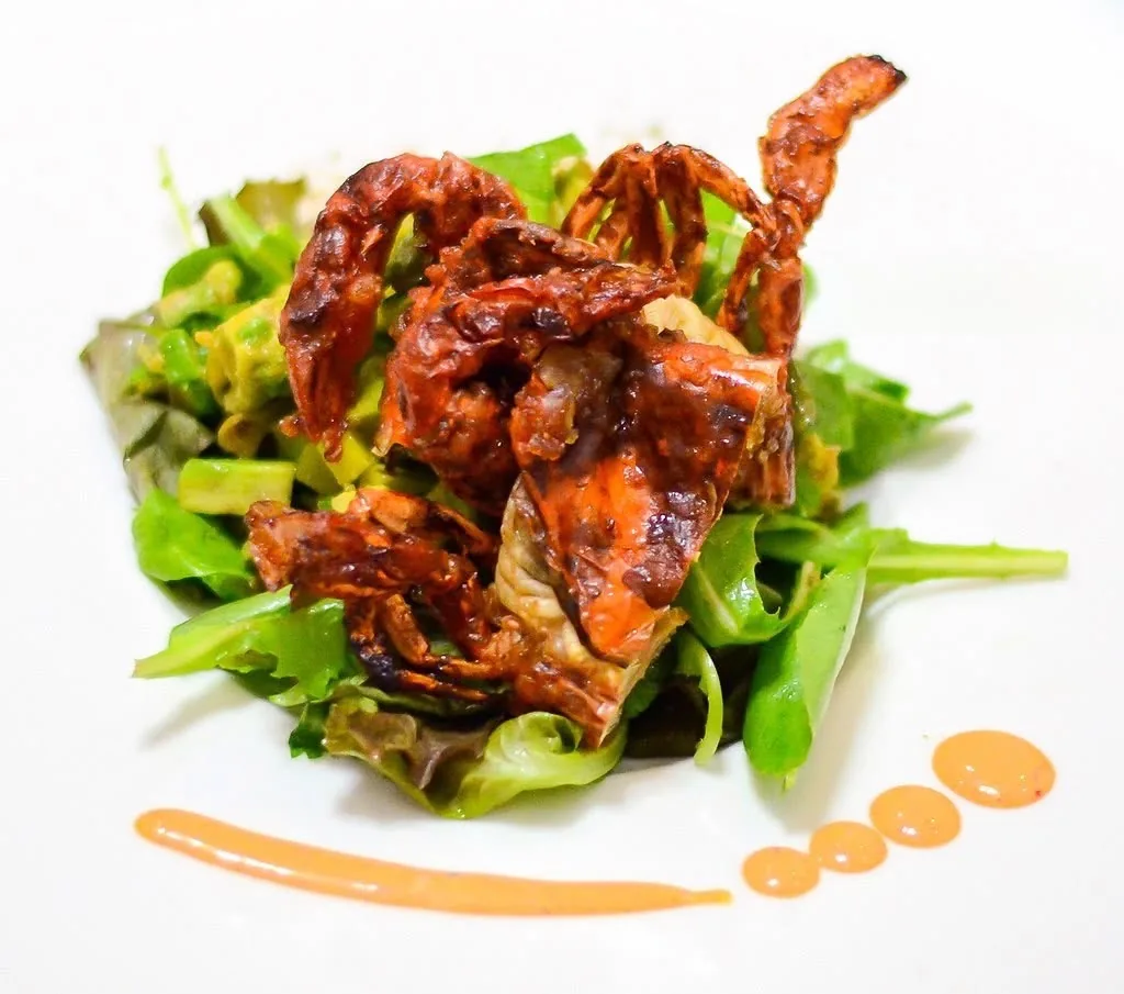 Crispy soft-shell crab on a fresh green salad