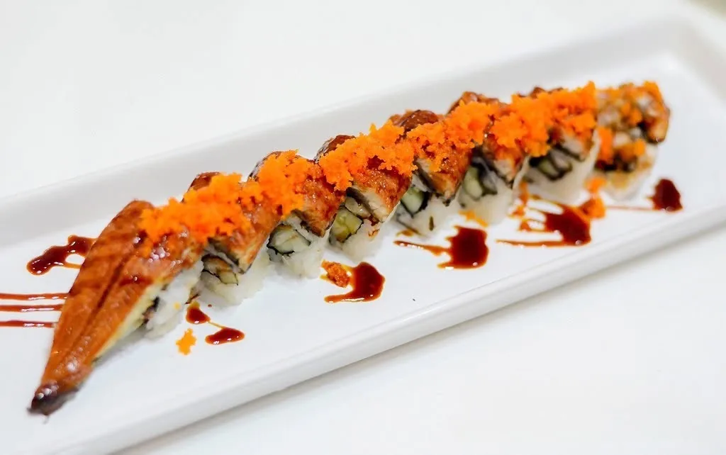 Grilled eel roll plated on a white dish